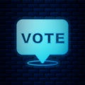 Glowing neon Vote icon isolated on brick wall background. Vector