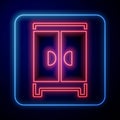 Glowing neon Wardrobe icon isolated on black background. Cupboard sign. Vector