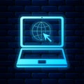 Glowing neon Website on laptop screen icon isolated on brick wall background. Laptop with globe and cursor. World wide Royalty Free Stock Photo