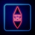 Glowing neon Wizard warlock icon isolated on blue background. Vector