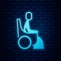 Glowing neon Woman in wheelchair for disabled person icon isolated on brick wall background. Vector Royalty Free Stock Photo