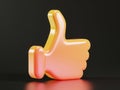 A glowing orange thumbs up sign on a black background Royalty Free Stock Photo