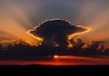 A glowing outline around the towering cloud, casting rays across Royalty Free Stock Photo