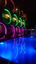 Glowing outside of a Hotel Building, blue Swimming pool in the night.