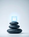 Cybersecurity Balance Lock Icon on Stacked Stones Royalty Free Stock Photo