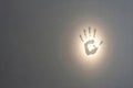 Glowing palm print on the wall. Space for text. Royalty Free Stock Photo