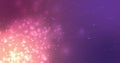 Glowing pink particles effervescing on a dark purple background