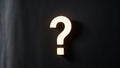 Glowing question mark on dark background. Royalty Free Stock Photo