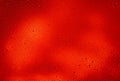 Glowing red background with contrasting water drops Royalty Free Stock Photo