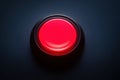 Glowing Red Button in Dark Environment. Minimalistic Background. Royalty Free Stock Photo