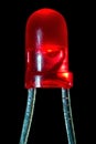 Glowing red LED with a diameter of 3 mm on a black background Royalty Free Stock Photo