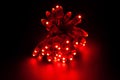 Glowing RED led pixels christmas holiday lights on black background Royalty Free Stock Photo