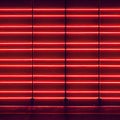 Glowing red neon glowing abstract horizontal lines geometric background.