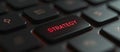 Glowing Red \'Strategy\' Key on a Dark Computer Keyboard for Business Concept Royalty Free Stock Photo