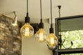 Glowing retro light bulbs hanging from ceiling