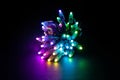 Glowing RGB led pixels christmas holiday lights on black background Royalty Free Stock Photo