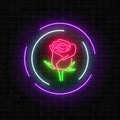 Glowing rose neon sign of flower shop in round frames on dark brick wall background. Design of floral store signboard.