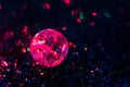 Glowing, shiny ball of broken glass on a shiny background, bokeh, balls, blurred circles, lights in the dark. Royalty Free Stock Photo