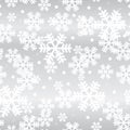 Glowing silver Christmas snowflakes seamless pattern