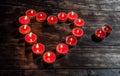 Glowing small red candles arranged in heart shape Royalty Free Stock Photo