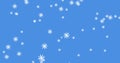 Glowing snow particles falling against blue background Royalty Free Stock Photo