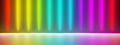 Glowing spectrum rainbow colored spotlights with reflective floor on black dark background