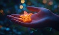 Glowing star ornament held in hand with festive bokeh background Royalty Free Stock Photo