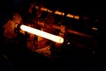 Glowing steel tube during production in a modern rolling mill in the industry Royalty Free Stock Photo