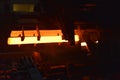 Glowing steel tube during production in a modern rolling mill in the industry Royalty Free Stock Photo