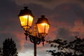 Glowing street lamp in the dusk Royalty Free Stock Photo