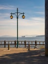 Glowing street lamp at the harbour in Vancouver Island. View from the pier Royalty Free Stock Photo