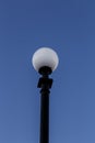 Glowing street lamp with sky