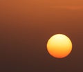 Glowing sun on dark orange sky Royalty Free Stock Photo