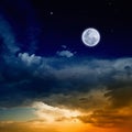 Glowing sunset and full moon Royalty Free Stock Photo