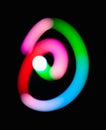 Glowing `at` symbol. Email. Dark background. Hashtag. Commercial at. Abstract night light painting. Creative artistic Royalty Free Stock Photo