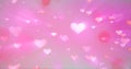 Glowing tender flying love hearts on a pink background