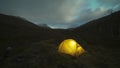 Glowing Tent and Clouds at Night in Khibiny Mountains. Russia. Time Lapse