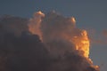 GLOWING TINT ON SIDE OF CUMULUS CLOUD Royalty Free Stock Photo