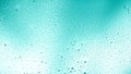 Glowing gradient turquoise background with contrasting water drops Royalty Free Stock Photo