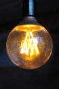 Glowing vintage light bulb. Royalty Free Stock Photo