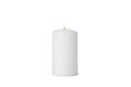 Glowing white candle isolated on background