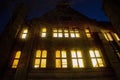 Glowing windows on a building at Yale University at night