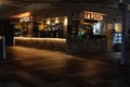 Glowing "LA PIZZA" sign outdoors at night in Cairns, Australia