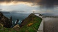 Glows Cape Ortegal Lighthouse Province of A Coruna, Galicia, Spain. Summer rainy evening view Royalty Free Stock Photo