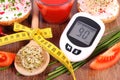 Glucometer, freshly sandwich, tomato juice and centimeter, diabetes, healthy nutrition