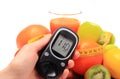Glucometer, fruits, dumbbells, tape measure and glass of juice Royalty Free Stock Photo