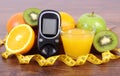 Glucometer, fruits, juice and tape measure, diabetes lifestyles and nutrition Royalty Free Stock Photo