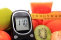 Glucometer, fruits, tape measure, juice and dumbbells Royalty Free Stock Photo