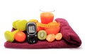 Glucometer, fruits, tape measure, juice and dumbbells Royalty Free Stock Photo