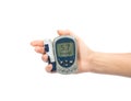 Glucometer in hand for measuring glucose level blood